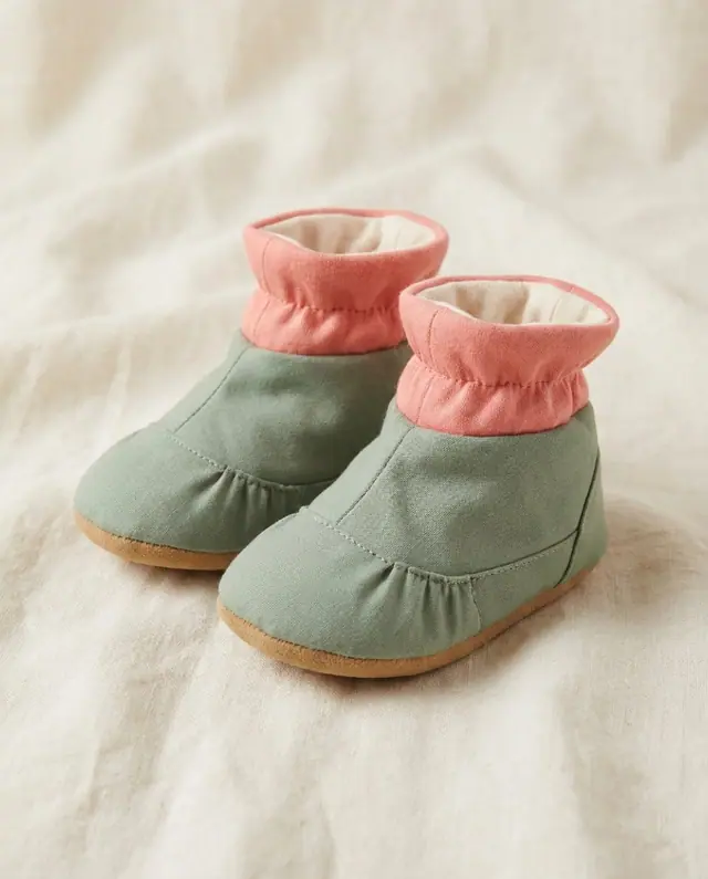 A finished baby booties sewn from the Sewzy pattern